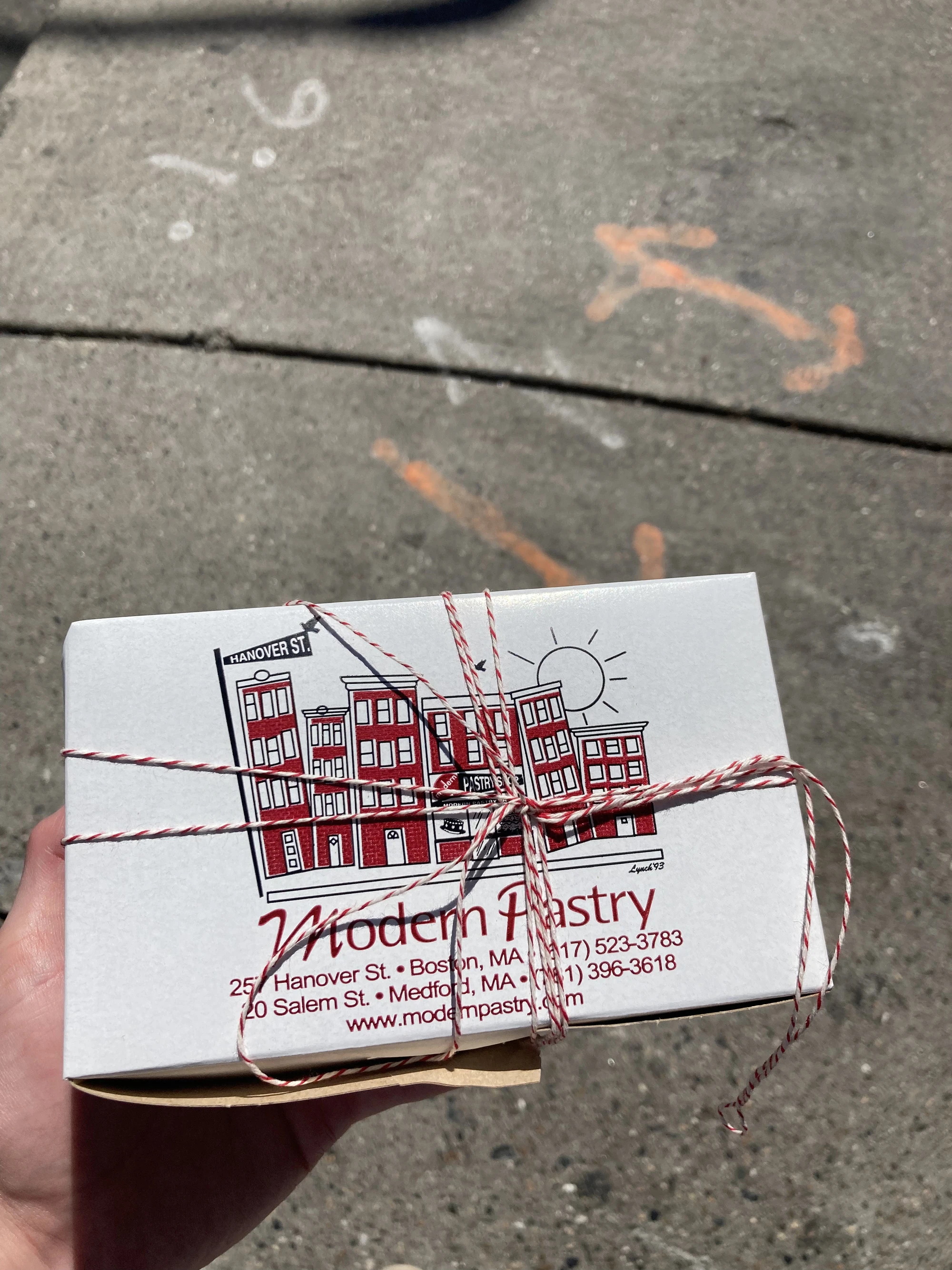 Closed box of Modern Pastry's cannoli